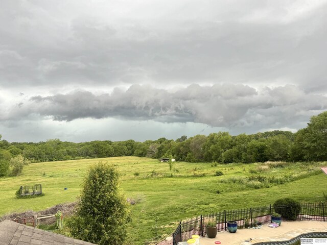 view of yard with a rural view