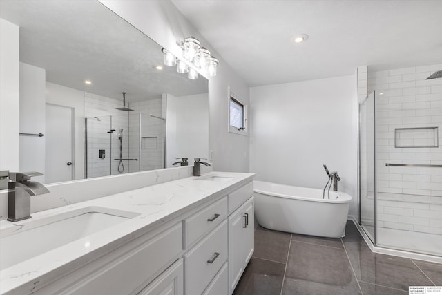 bathroom featuring vanity and independent shower and bath