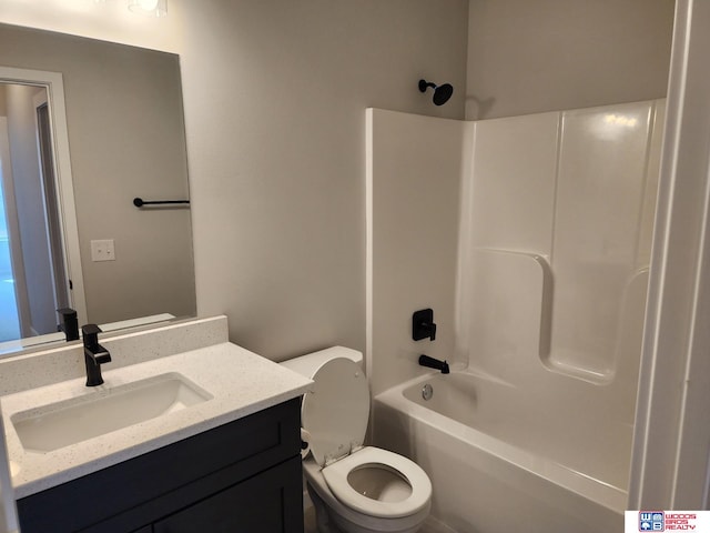 full bathroom with toilet, vanity, and bathing tub / shower combination