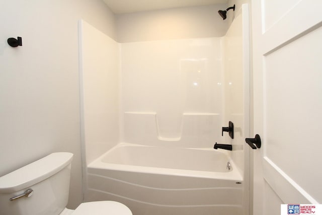 bathroom featuring toilet and shower / bath combination