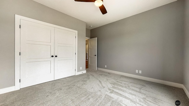 unfurnished bedroom featuring carpet flooring, ceiling fan, and a closet