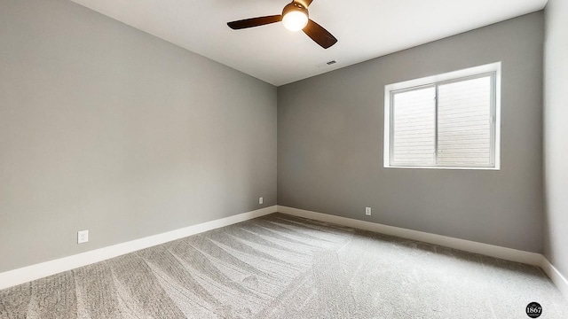 carpeted empty room with ceiling fan