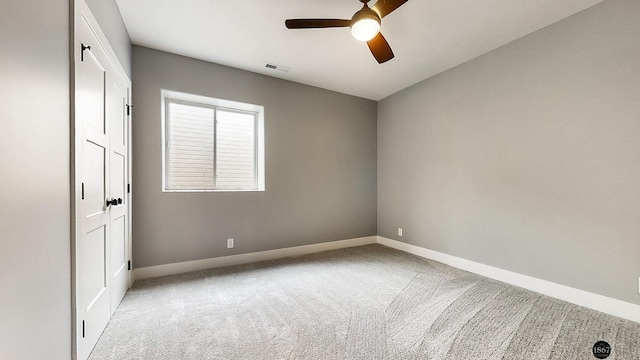 carpeted empty room with ceiling fan