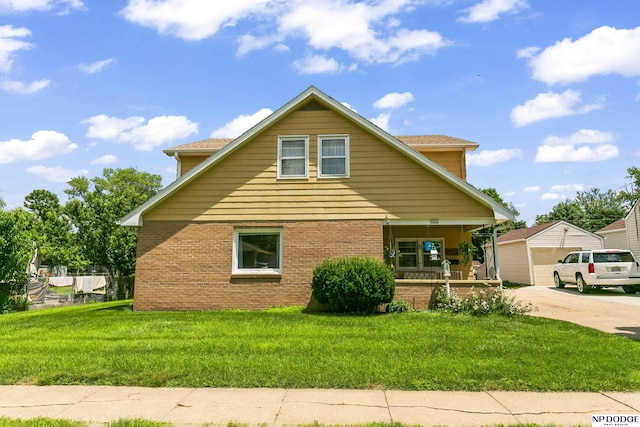 view of side of home featuring a porch, a yard, and a garage