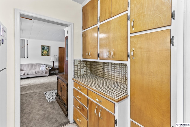 kitchen with light colored carpet