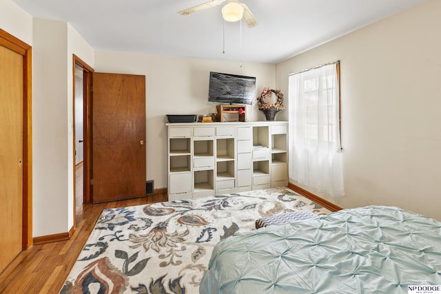 bedroom with ceiling fan and light hardwood / wood-style floors