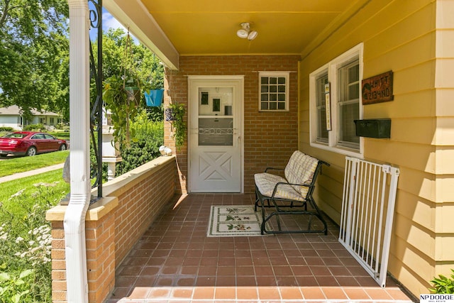 entrance to property featuring covered porch