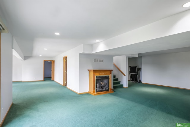 unfurnished living room featuring carpet