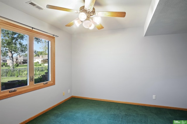 unfurnished room featuring carpet flooring and ceiling fan