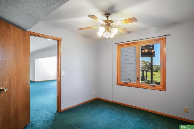 carpeted spare room with ceiling fan and a textured ceiling