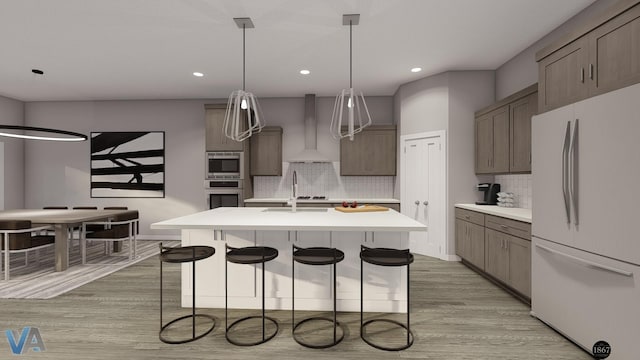 kitchen featuring hanging light fixtures, tasteful backsplash, a kitchen island with sink, appliances with stainless steel finishes, and custom exhaust hood