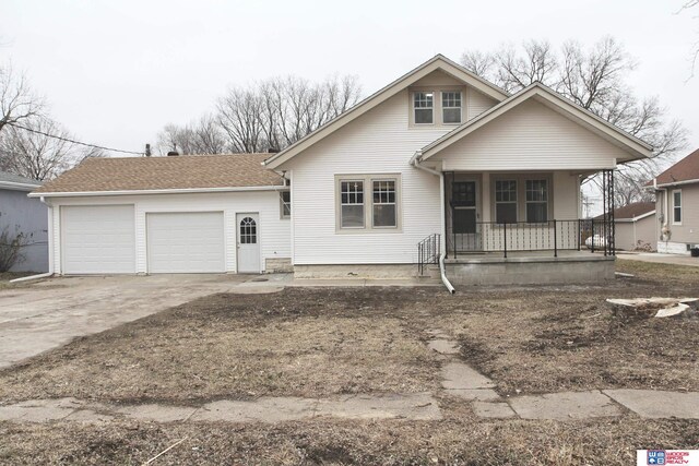 view of front of home with a garage and covered porch