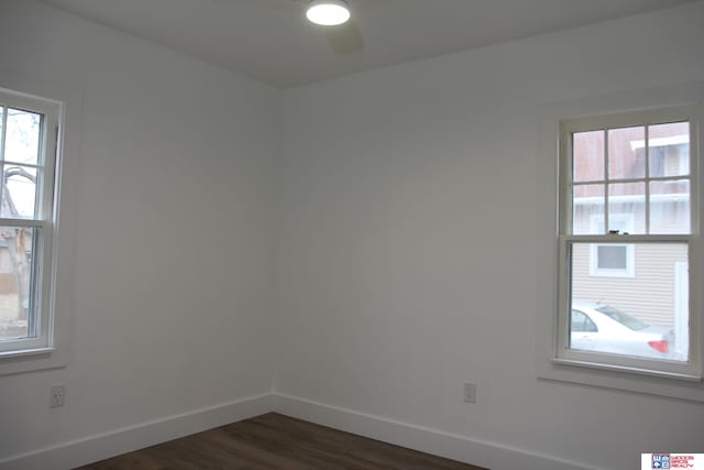 empty room with dark hardwood / wood-style floors