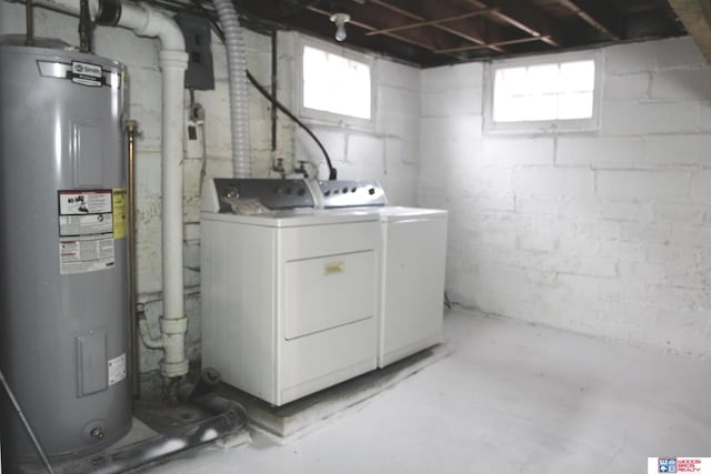 washroom featuring washer and dryer and water heater