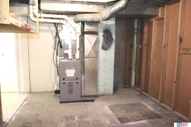 utility room with heating unit