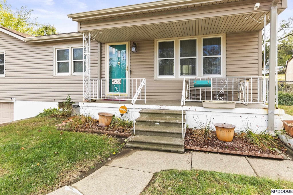 entrance to property with covered porch