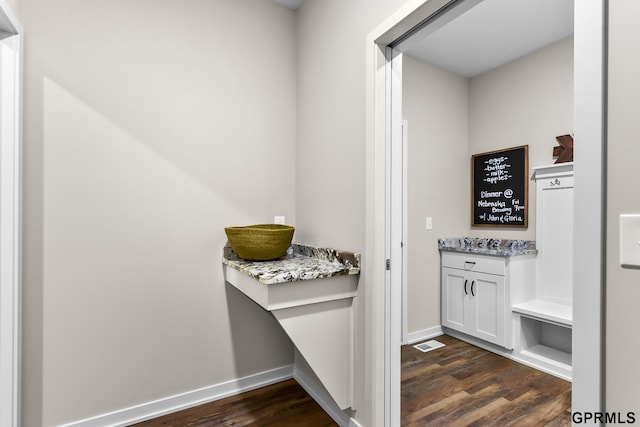 interior space with dark hardwood / wood-style floors