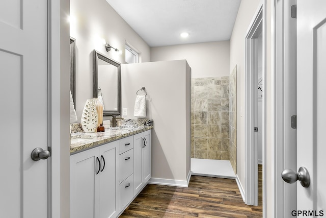 bathroom with vanity and wood-type flooring