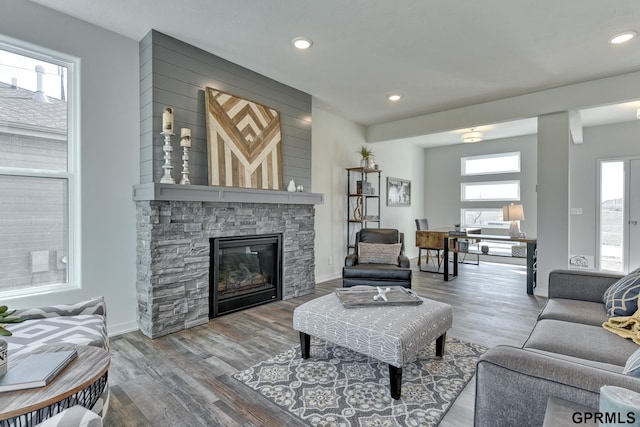 living room featuring hardwood / wood-style flooring and a fireplace