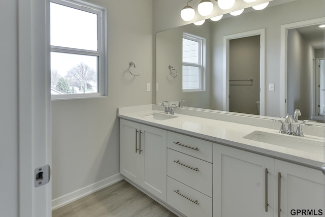 bathroom with vanity, hardwood / wood-style flooring, toilet, and plenty of natural light