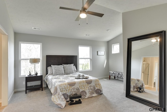 carpeted bedroom featuring ceiling fan and lofted ceiling