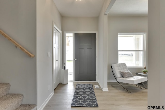 foyer with light hardwood / wood-style flooring