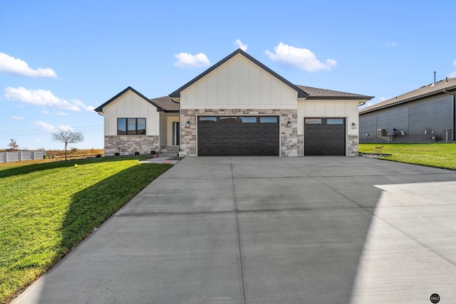 modern farmhouse style home with a garage and a front lawn