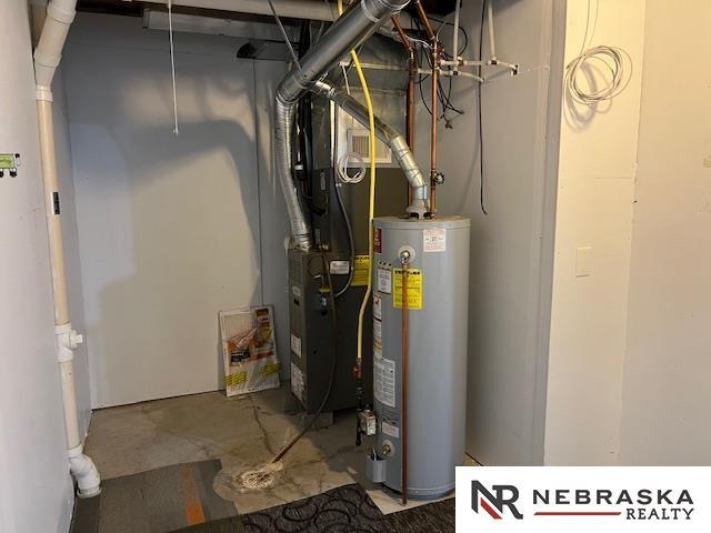 utility room with water heater