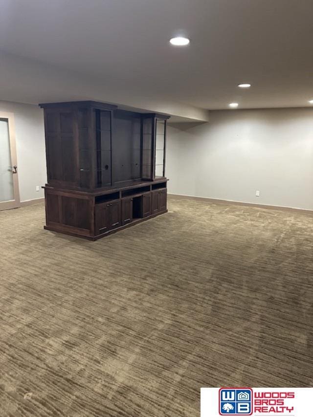 basement with dark colored carpet