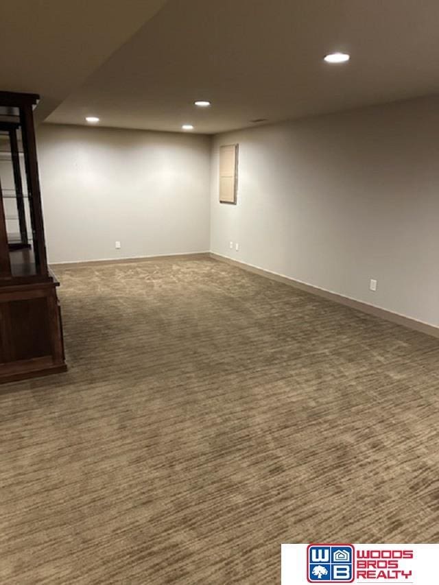 basement with dark colored carpet