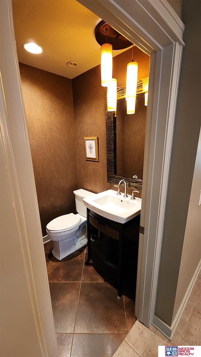 bathroom with vanity and toilet