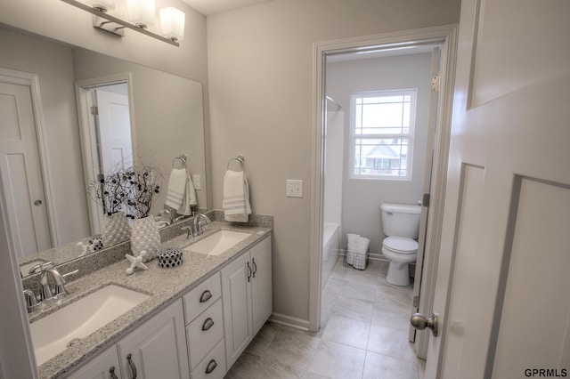 full bathroom featuring tile patterned flooring, vanity,  shower combination, and toilet