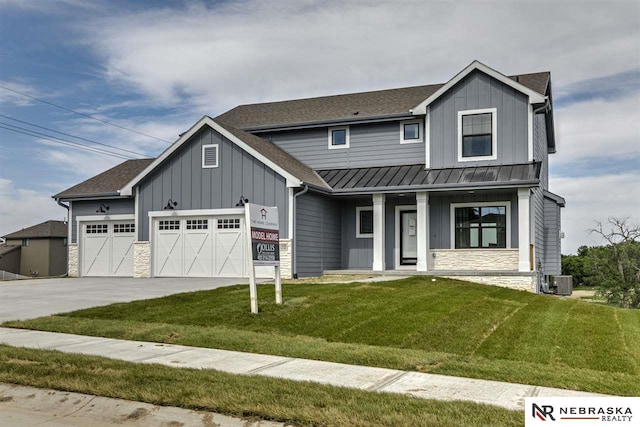 view of front facade featuring a porch, a garage, a front lawn, and cooling unit