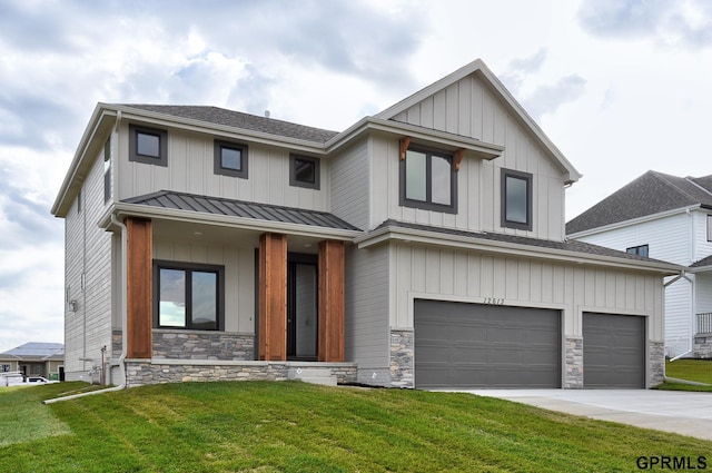 view of front of property with a front yard and a garage