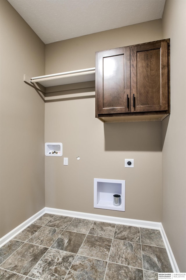 laundry area featuring cabinets, washer hookup, and hookup for an electric dryer