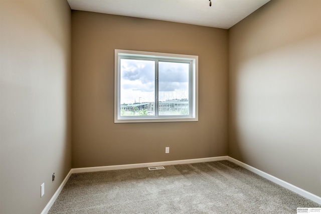 view of carpeted spare room