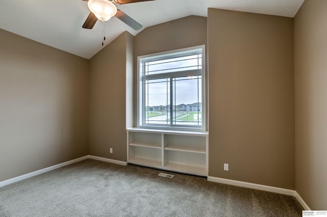 additional living space featuring ceiling fan, carpet floors, and vaulted ceiling