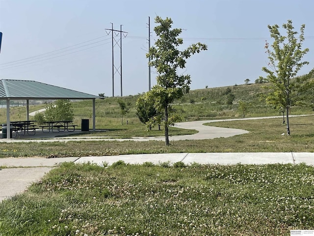 surrounding community featuring a lawn