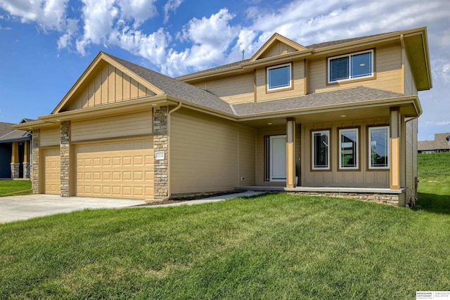 view of front of house with a front yard and a garage