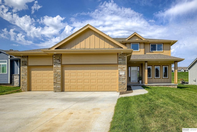 view of front of property featuring a front yard and a garage