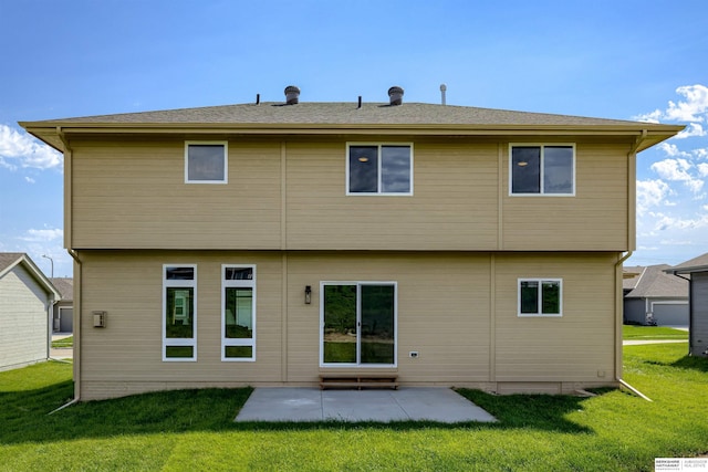 rear view of property with a patio area and a yard