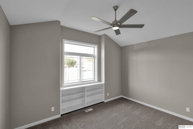 additional living space with ceiling fan and carpet floors