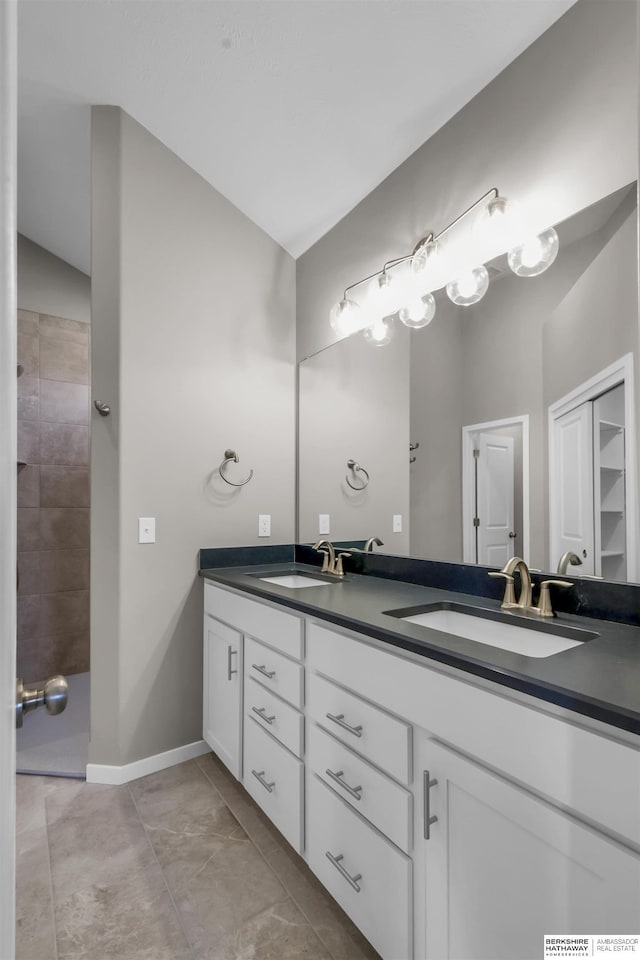 bathroom featuring tile patterned floors and vanity