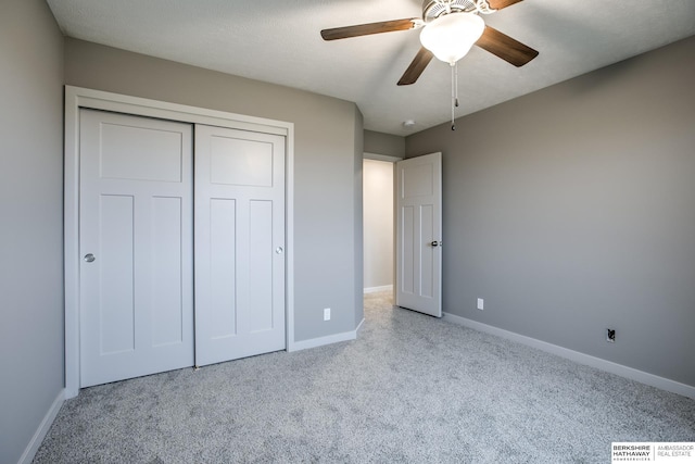 unfurnished bedroom featuring a closet and ceiling fan