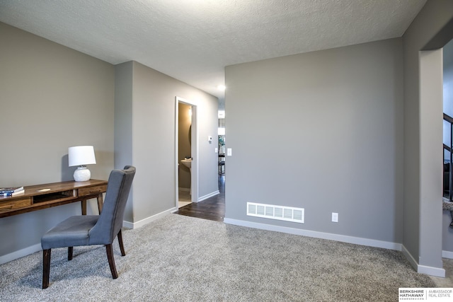 office space featuring a textured ceiling