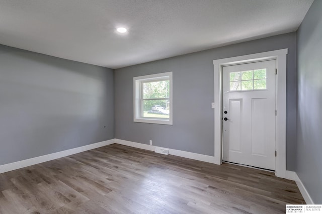 entryway with light hardwood / wood-style flooring