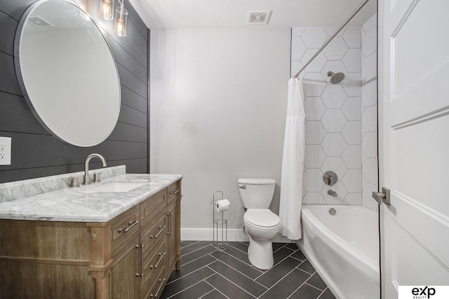 full bathroom featuring shower / tub combo with curtain, vanity, toilet, and tile patterned flooring