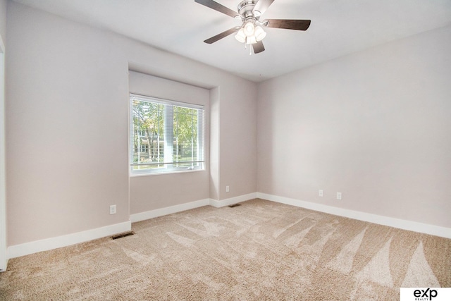 carpeted empty room with ceiling fan