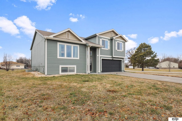 view of front of house with a garage and a front yard