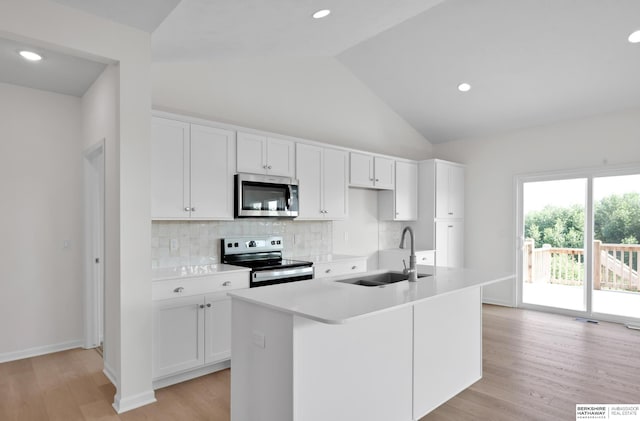 kitchen with sink, white cabinets, an island with sink, and appliances with stainless steel finishes